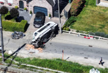 Scene where school bus was struck by train at a level crossing in Belgium